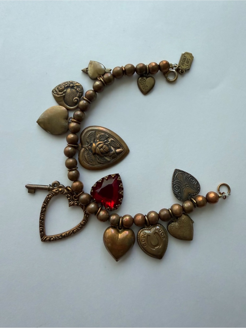 Antique Brass Heart Charm Bracelet with Red Teardrop Gem